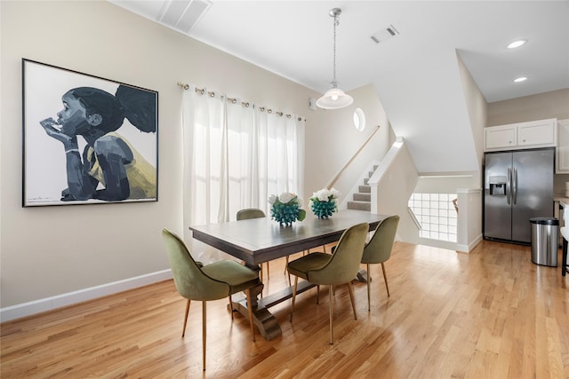 dining room with light hardwood / wood-style flooring