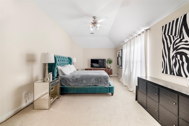 bedroom featuring lofted ceiling, light colored carpet, and ceiling fan