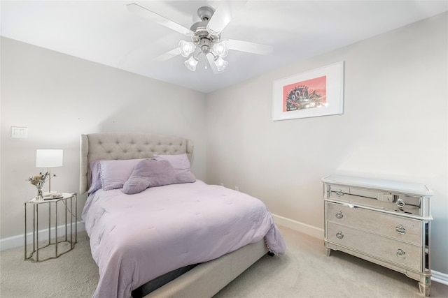 bedroom featuring light carpet and ceiling fan