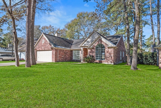 view of front of house with a garage and a front yard