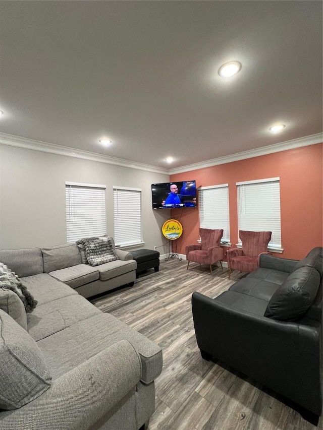 living room featuring ornamental molding and wood-type flooring