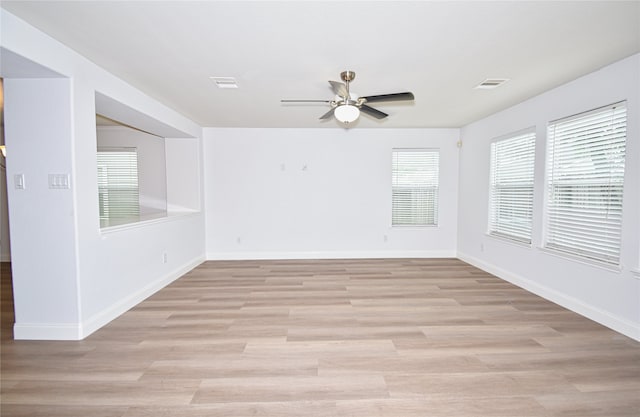 unfurnished room featuring ceiling fan and light wood-type flooring