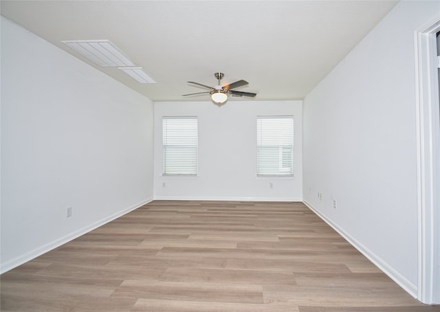 spare room with ceiling fan and light hardwood / wood-style floors