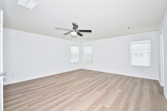 unfurnished room featuring ceiling fan and light wood-type flooring