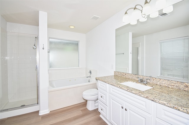 full bathroom with vanity, wood-type flooring, toilet, and separate shower and tub