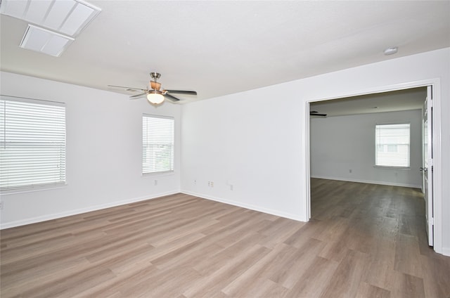 unfurnished room featuring ceiling fan and light wood-type flooring