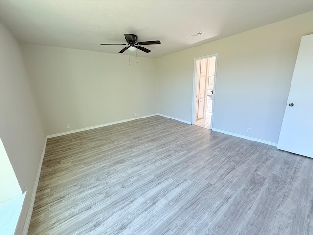 unfurnished room with ceiling fan and light hardwood / wood-style flooring