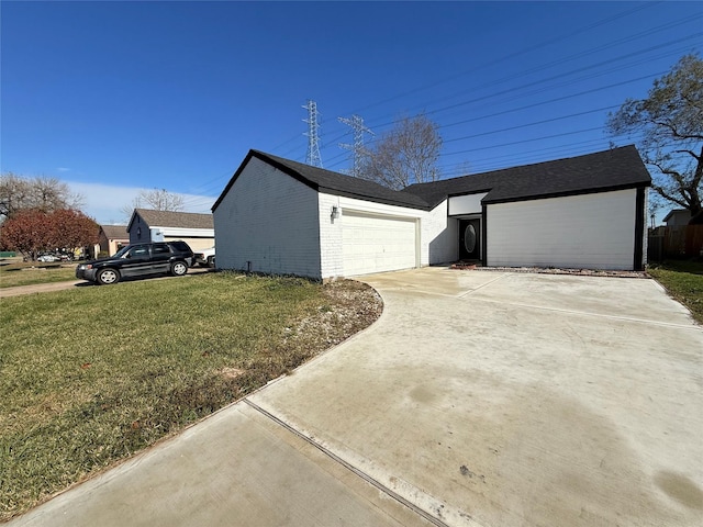 view of side of home featuring a lawn