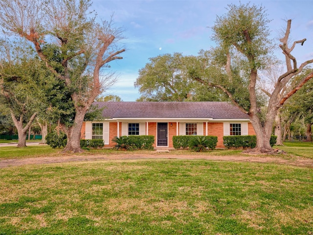 ranch-style house with a front lawn