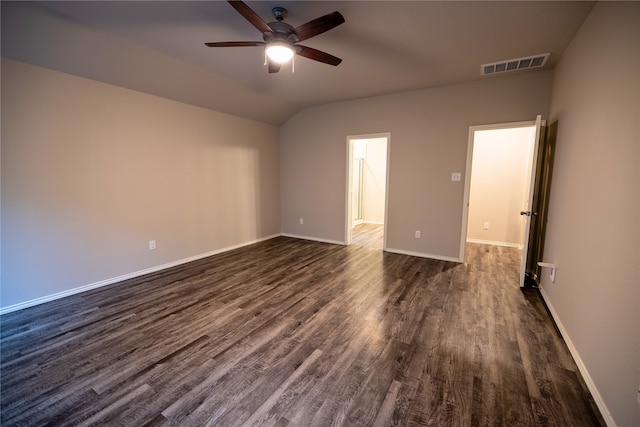 unfurnished room featuring dark wood-type flooring, ceiling fan, and lofted ceiling