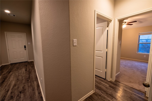 hall with dark hardwood / wood-style flooring