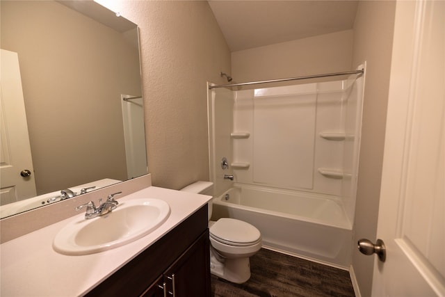 full bathroom featuring vanity, hardwood / wood-style floors, tub / shower combination, and toilet