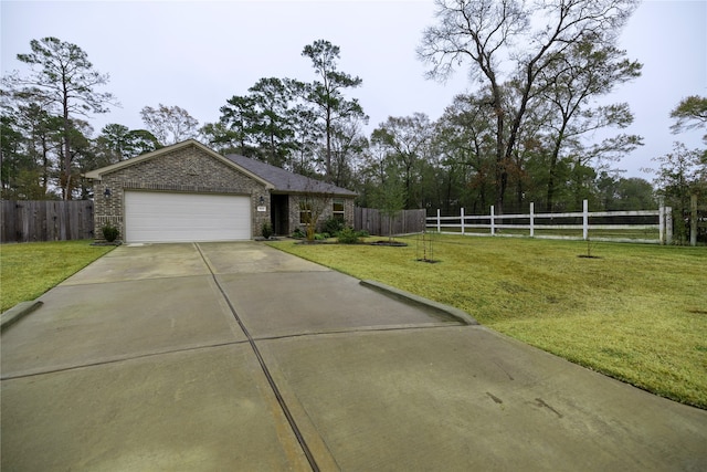 view of front of house with a garage and a front lawn