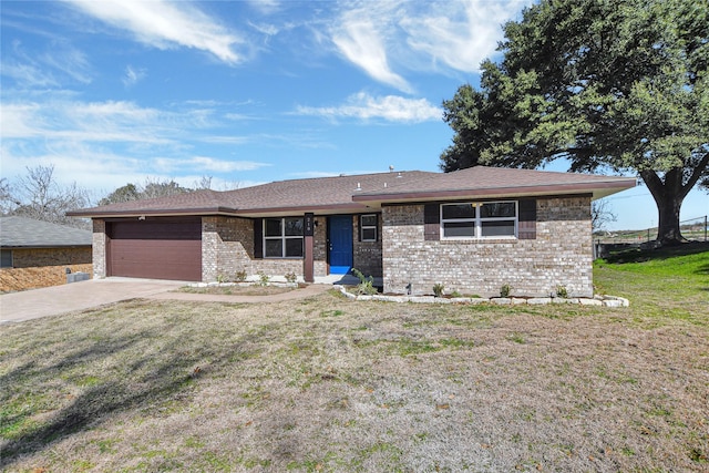 single story home featuring a garage, a front yard, concrete driveway, and brick siding