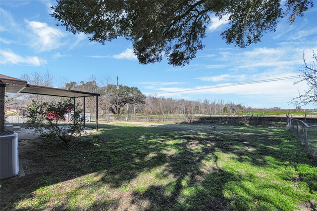 view of yard featuring central AC