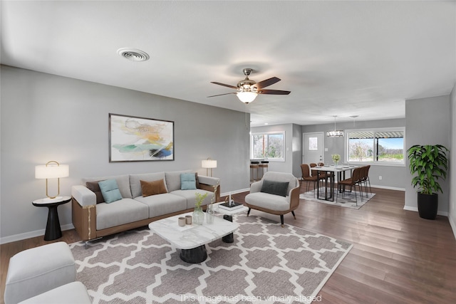 living room with hardwood / wood-style flooring and ceiling fan