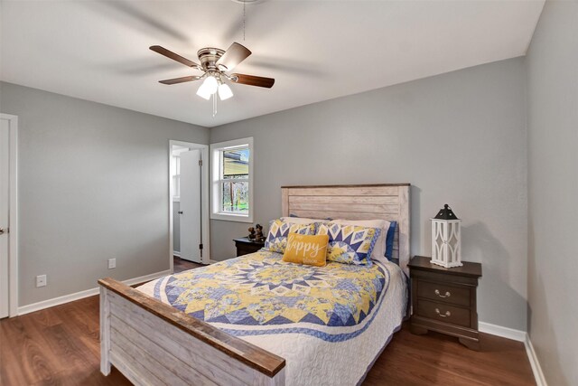 bedroom with ceiling fan and dark hardwood / wood-style flooring