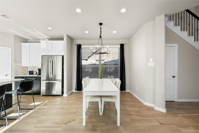 dining space with a chandelier