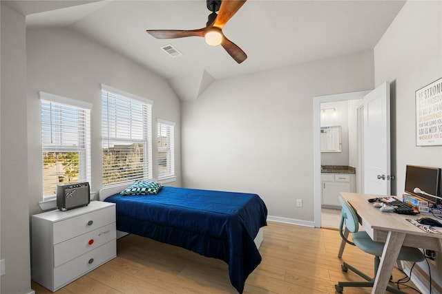 bedroom with lofted ceiling, connected bathroom, ceiling fan, and light hardwood / wood-style flooring