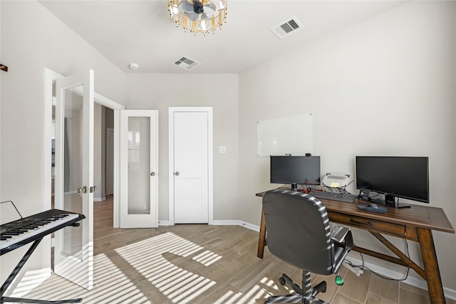 office featuring french doors and light hardwood / wood-style floors