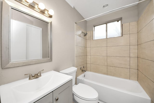 full bathroom featuring vanity, toilet, and tiled shower / bath combo