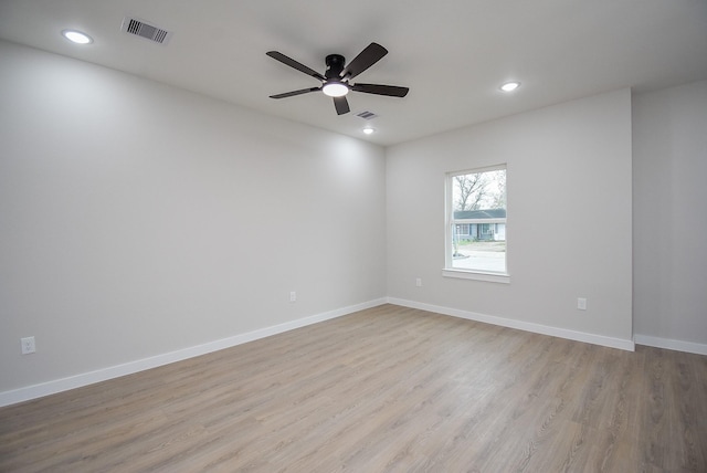 spare room with ceiling fan and light hardwood / wood-style flooring