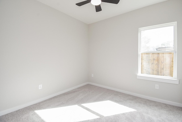 carpeted empty room with ceiling fan