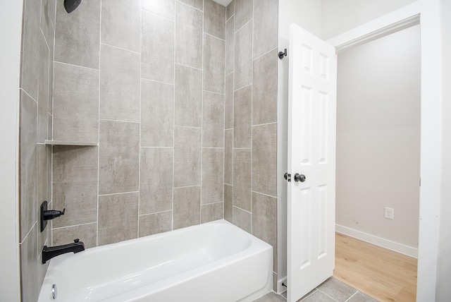 bathroom featuring tile patterned floors and bathtub / shower combination