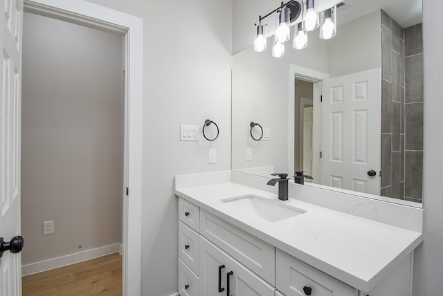 bathroom featuring vanity and wood-type flooring