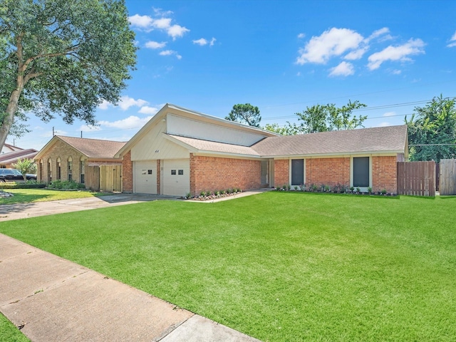 ranch-style house featuring a garage and a front yard