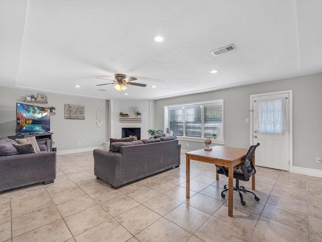 tiled living room featuring ceiling fan