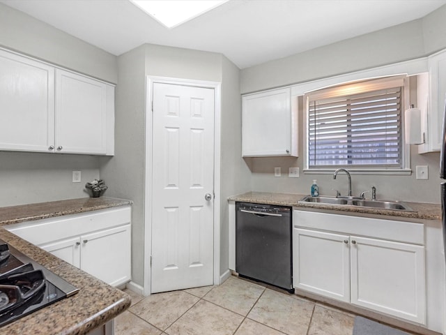 kitchen with white cabinets, light tile patterned floors, sink, and black appliances