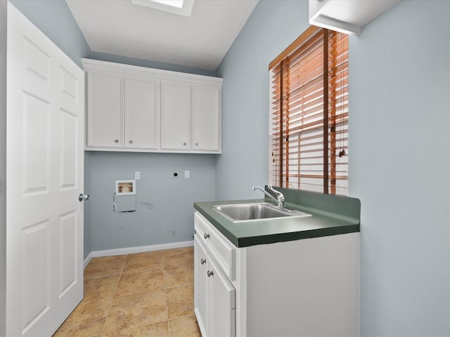 washroom with hookup for a washing machine, a skylight, a sink, cabinet space, and electric dryer hookup