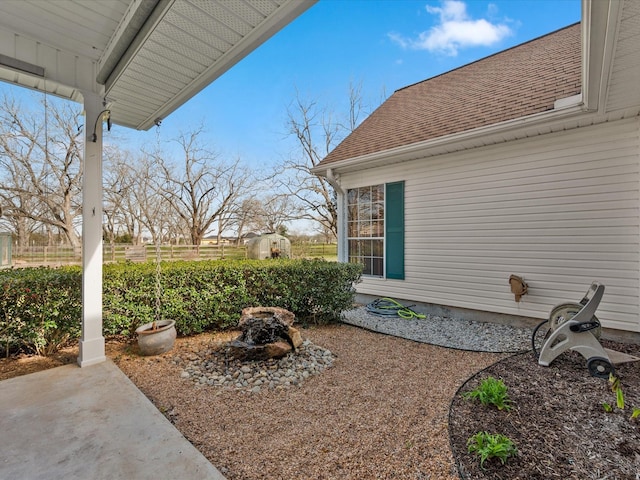 view of yard featuring a patio and fence