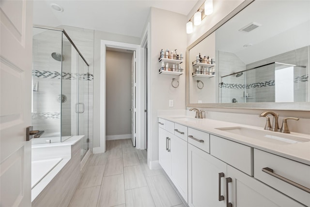 bathroom featuring vanity and separate shower and tub