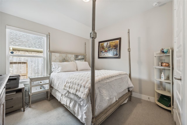 bedroom with multiple windows and light carpet