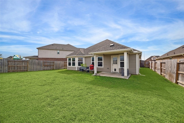 back of property featuring a lawn and a patio area