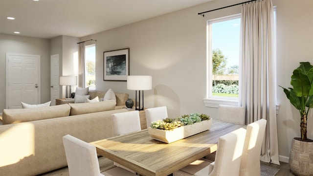 dining area with a wealth of natural light and light hardwood / wood-style flooring