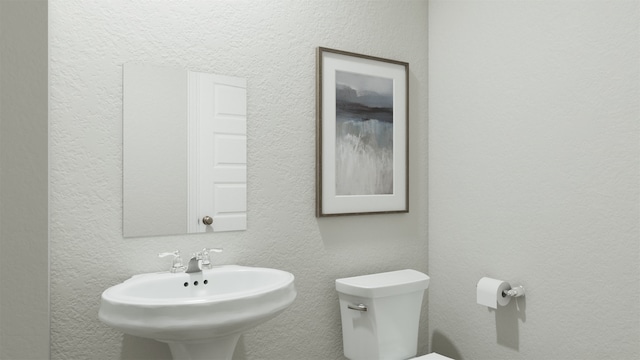 bathroom with sink and toilet