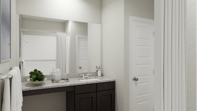 bathroom with vanity and curtained shower