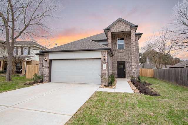 view of front of house with a garage, a front yard, brick siding, and fence