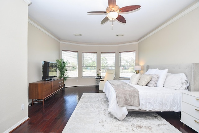 bedroom with ceiling fan, ornamental molding, and dark hardwood / wood-style flooring