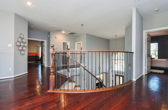 hall with hardwood / wood-style floors