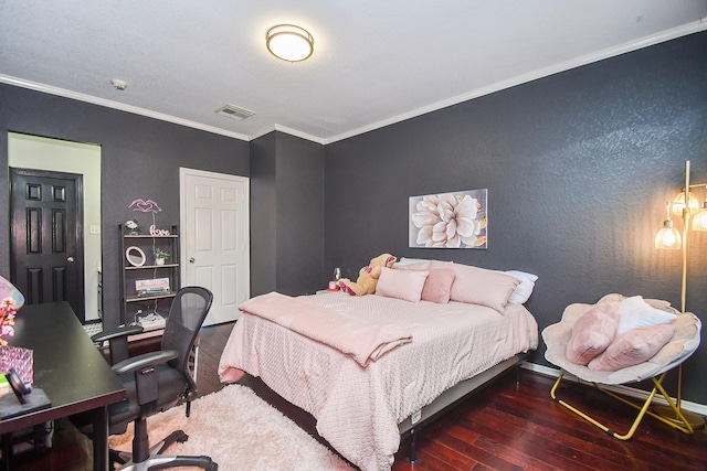 bedroom with ornamental molding and dark wood-type flooring
