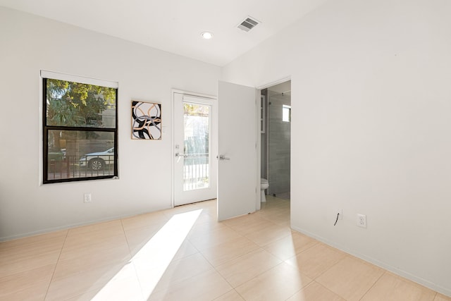 entryway with light tile patterned floors