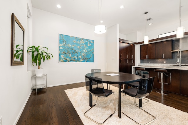 dining area with dark wood-type flooring