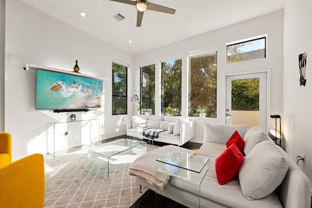 sunroom featuring ceiling fan