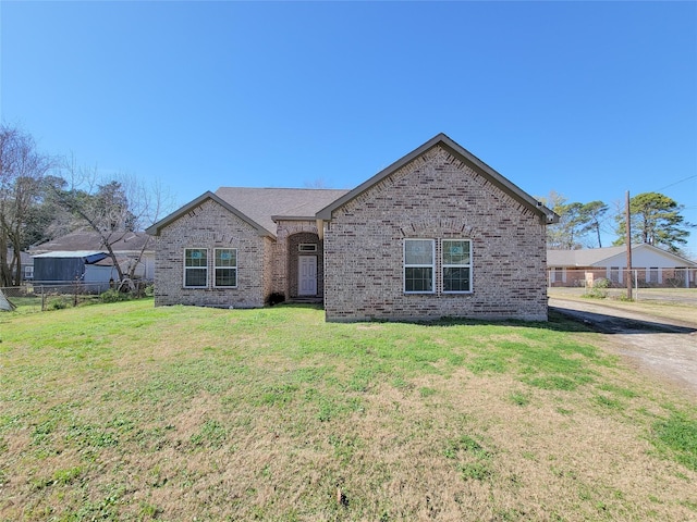 ranch-style house with a front yard