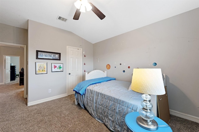 carpeted bedroom with vaulted ceiling and ceiling fan