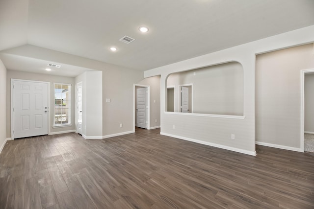 unfurnished living room featuring dark hardwood / wood-style flooring